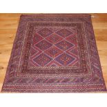 A Kazak tribal rug, blue and red with a diamond ground within a multi-panel border, 122 x 134cm.