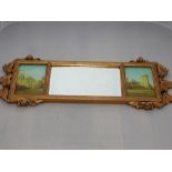 A gilt framed wall mirror, the central rectangular plate flanked by views of a castle, W. 87cm.