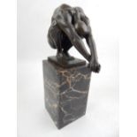 A bronze figure of a diver, raised on a marble plinth base, H. 24cm.