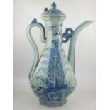 A large oriental blue and white teapot, of octagonal form and decorated with dragons amongst clouds,