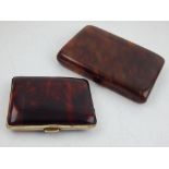 An early 20th century tortoiseshell cigarette case, W. 12cm, together with another smaller, (2).