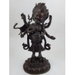 A South East Asian bronze model of a deity, H.