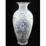 A Chinese blue and white vase, decorated with vignettes of dragons and phoenixes chasing flaming