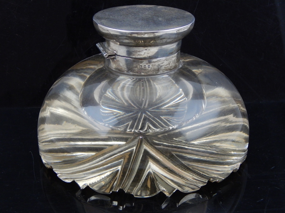 An Art Deco glass and silver topped inkwell, London 1937, the glass base of circular form with