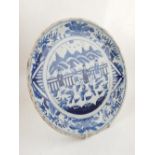 A Chinese blue and white charger, decorated with a nobleman on horseback with attendants on a