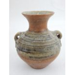 A twin-handled stoneware baluster vase, with everted rim. H. 14cm