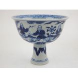 A Chinese blue and white porcelain stem bowl, the interior decorated with foliage within a geometric