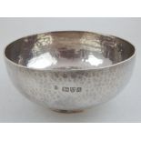 A planished silver bowl, Chester 1901, George Nathan & Ridley Hayes, inset with an Edward VII half
