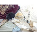 A collection of fifteen hand-painted fans, of various designs, sizes and materials. (15)
