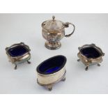 A pair of silver salts, Birmingham 1933, square with blue glass liners and raised on pad feet,