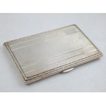 A silver rectangular cigarette case, Birmingham 1918, with stepped engine turned covers, 7.5oz.