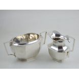 A silver milk jug and sucrier, Birmingham 1887 & '88, of rectangular faceted form, 13ozt.