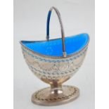 A George III silver sugar basket, with bright blue glass liner, London 1785 by Robert Hennell I,