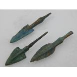 Three bronze arrow heads.