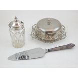 A Victorian silver topped glass bottle, together with a silver handled cake slicer, silver handled