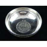 A Qajar white metal coin dish, engraved with foliage to exterior, purity marks to base