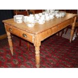 A Victorian rectangular pine kitchen table, fitted drawer on turned tapered legs, 150 x 86 cms