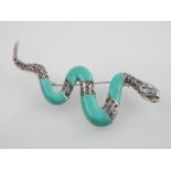 A silver, marcasite and turquoise snake brooch.
