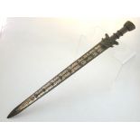 A Chinese bronze small sword, with mask to hilt, the blade gilt decorated with characters. L. 57cm