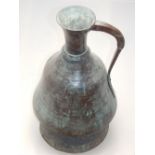 A Middle Eastern ewer, of bell form. H. 54cm