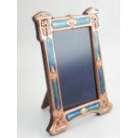 An Art Nouveau style copper and enamel easel mirror. H. 21cm