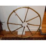 A 19th century brass ships wheel, of a large diameter with an arrangement of right spokes, D. 95cm.