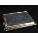 An silver plated Asprey retractable serving tray.