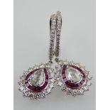 A pair of 18ct white gold, ruby and rose cut diamond drop earrings.