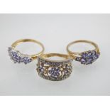 A 9ct yellow gold, tanzanite and diamond accent dress ring, together with two 9ct yellow gold and