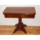 *WITHDRAWN* A 19th century mahogany tea table, the fold-over top above a reeded column support,