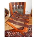 A pair of hardewood luggage racks, with dark tan leather webs (2).