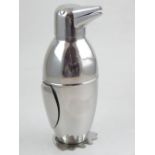 A plated novelty penguin cocktail shaker.