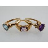 A 9ct yellow gold and rubover topaz ring, together with a 9ct yellow gold and amethyst cluster