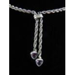 A 9ct white gold rope twist and heart cut amethyst necklace.