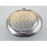 An early 20th century silver compact, indistinct hallmark to interior, with dustbag.