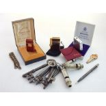 A collection of eight Victorian keys and three Metropolitan Police whistles, together with a