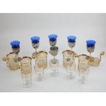 Five glass tea cup and gold plated cup holders, together with blue and silver plated sherry glasses,