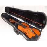 A 19th century German violin, with a two piece back, together with a hard case and bow, L. 33cm,