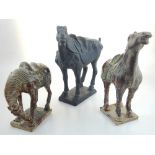 Three Chinese glazed earthenware Tang style horses, largest 27 cms.