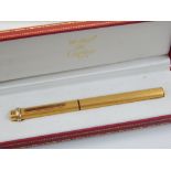 Must de Cartier gilt fountain pen, cased.