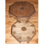 An Indonesian octagonal hardwood table, with steel mounts, W. 77cm, together with another smaller