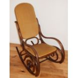 A Thonet style bentwood rocking chair, with upholstered pad back and seat. H. 105cm