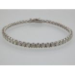 A 18ct white gold diamond tennis bracelet, diamonds of 4.37ct combined.