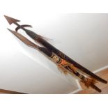 An African spear, with a leather clad shaft, L. 147cm, together with another, (2).