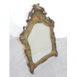 An early 20th century Italian easel mirror, the cartouche shaped plate within a grey foliate