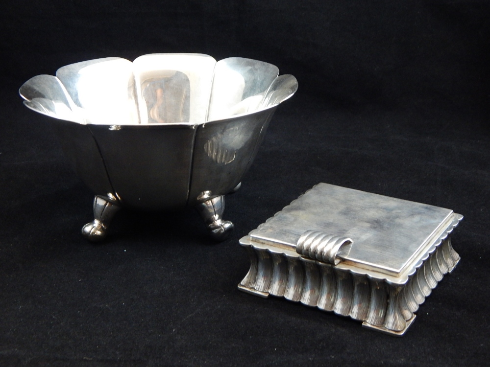 A Sterling silver bowl of fluted circular form on four cast scroll feet (12 oz) together with a