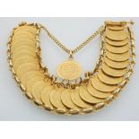 A gold bracelet, formed from and arrangement of twenty-six Middle Eastern gold coins, 59g.