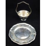 An Austria / Hungary circular silver dish with shaped border together with a fluted silver sugar