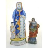 An early 20th century Quimper glazed earthenware figure of Saint Anne with Mary, H 30cms together