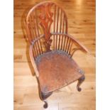 A late 18th century Thames Valley area yew and elm Windsor comb back elbow chair, with pierced